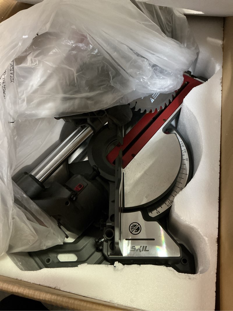 Condition photo showing As Is for skil 10-in 15-amp dual bevel sliding compound corded miter saw (charger not included)