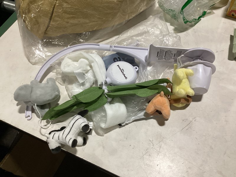 Condition photo showing As Is for the peanutshell crib mobile for boys or girls - white musical baby crib mobile with 12 lullabies, jungle animal, baby safari animals nursery decor