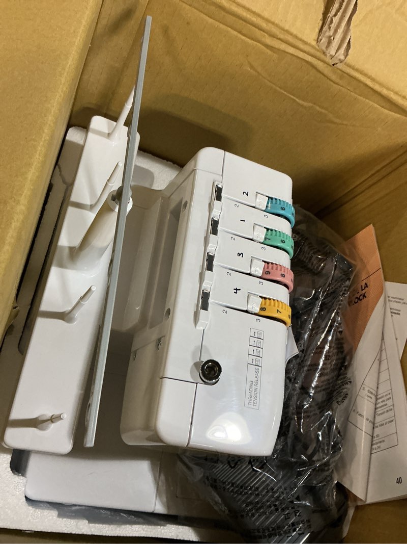 Condition photo showing Good Condition for brother serger, 1034d, heavy-duty metal frame overlock machine, 1,300 stitches per minute, removeable trim trap, 3 included accessory feet, white