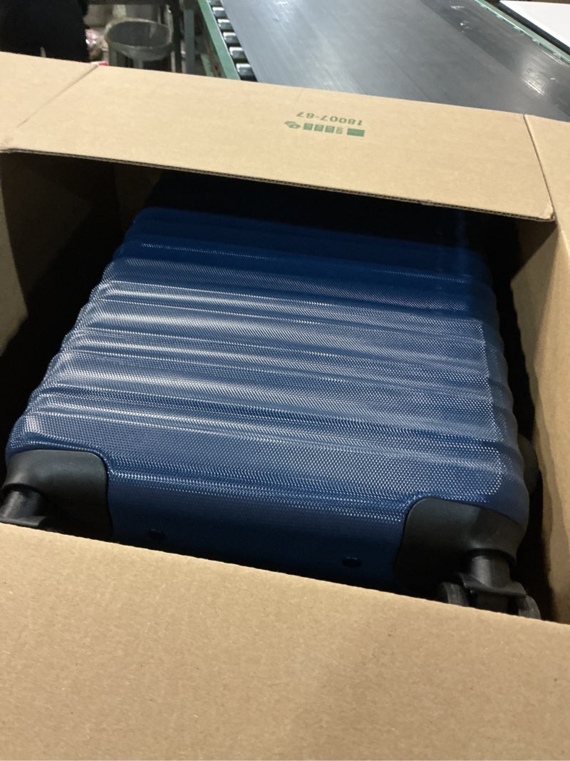 Condition photo showing Good Condition for Amazon Basics 21" Hardside Carry-On Luggage, Hardshell Suitcase With Wheels, Expandable For Up to 25% More Space, With Scratch-Resistant Surface, Four Multi-directional Wheels, Navy Blue Navy Blue Carry-On