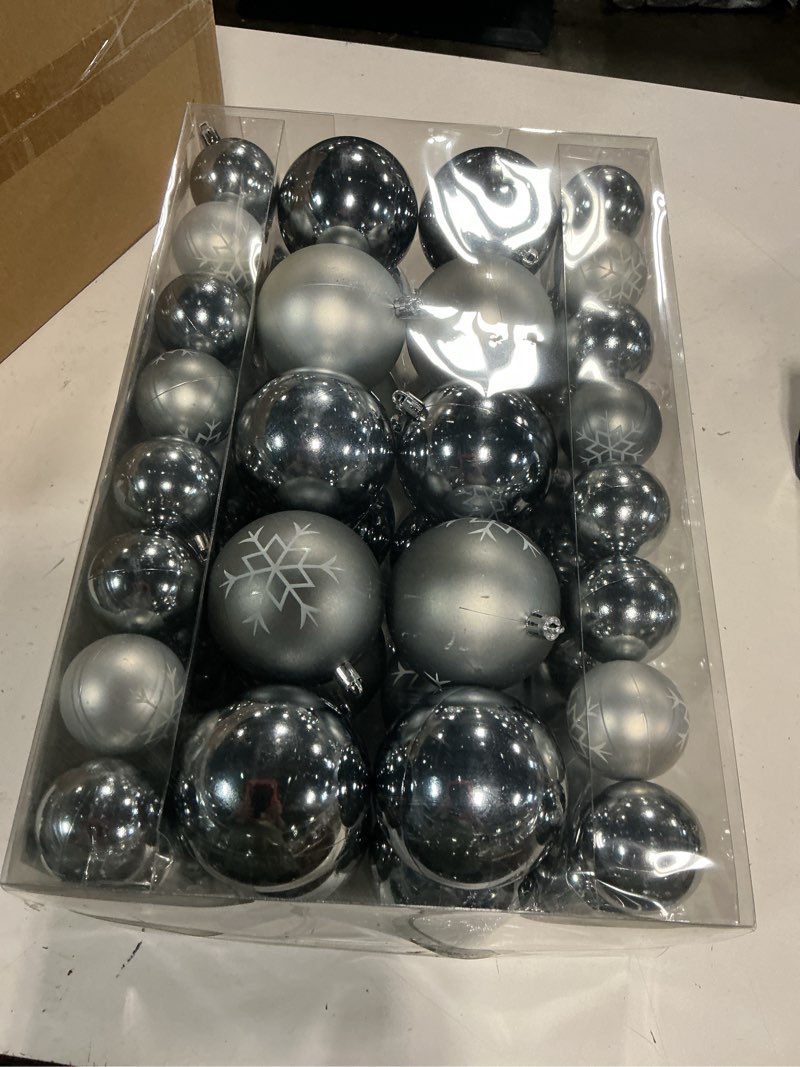 Condition photo showing New/Like New for set of 68 shatterproof plastic christmas tree ornaments in metallic silver and grey finishes.