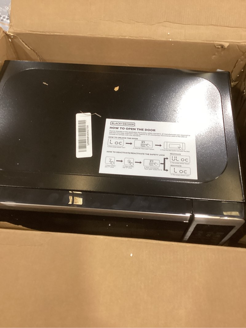 Condition photo showing As Is for black+decker em720cb7 digital microwave oven with turntable push-button door, child safety lock, 700w, stainless steel, 0.7 cu.ft 0.7 cu. ft.