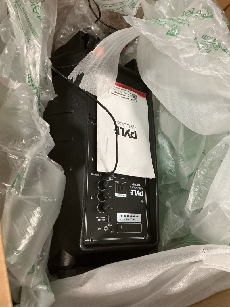 Condition photo showing As Is for Pyle PSBT105A - 1000W Portable Bluetooth PA Speaker, 10'' Subwoofer, UHF Wireless Mic, MP3/USB/SD, Rechargeable Battery, LED Battery Indicator Lights, Black