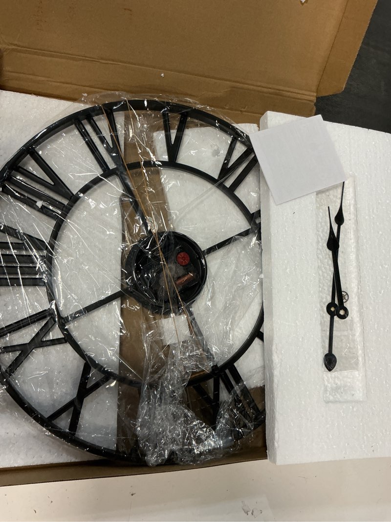 Condition photo showing item condition for 16 Inch Large Wall Clock, Modern Decorative Black Metal Silent Battery Operated Big Roman Numeral Wall Clock for Living Room, Bedroom, Kitchen, Office, Farmhouse, Housewarming Gift Black 16 Inch