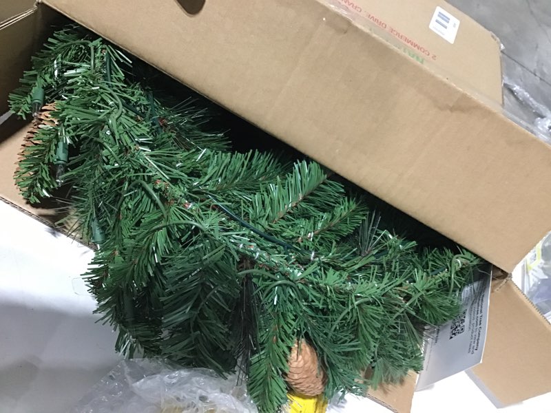 Condition photo showing As Is for National Tree Company 24 in Pre-Lit Crestwood Spruce Artificial Christmas Wreath, Christmas Decoration with Glitter, Pinecones, Red Berries, 50 Clear Lights, 160 Tips, Green 24 in Plug In Wreath