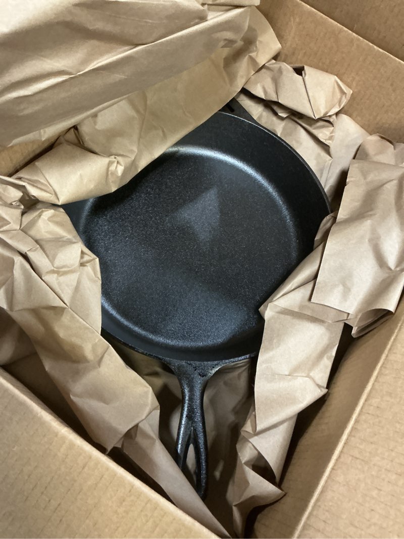 Condition photo showing Good Condition for Lodge 12 Inch Cast Iron Skillet with Red Silicone Hot Handle Holder – Pre-Seasoned Frying Pan for Stove, Oven, Grill & Campfire – Made in the USA – Durable, Nonstick Cast Iron Cookware – Black 12 inch + Hot Handle Holder