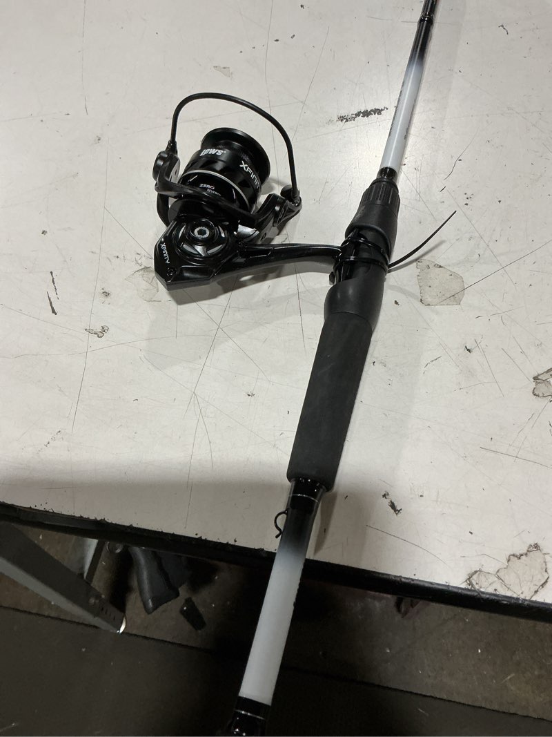 Condition photo showing As Is for lew’s xfinity spinning reel and fishing rod combo, 6-foot 6-inch, 1-piece rod, size 200 reel, strike king homing minnow lure