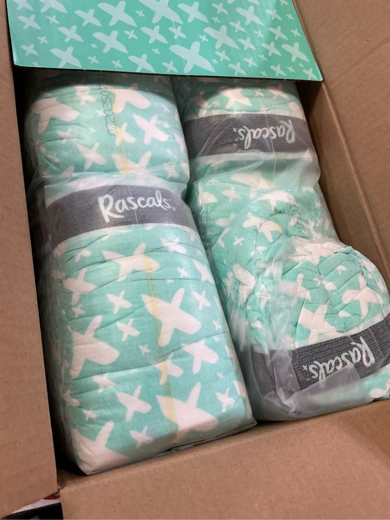 Condition photo showing As Is for rascals premium absorbent baby diapers size 2 96 count with 5 sensitive infant wipes