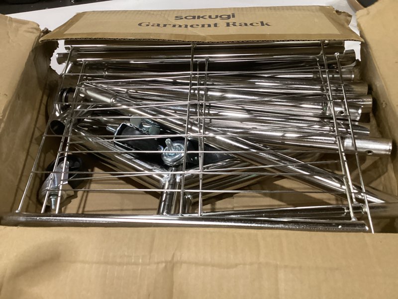 Condition photo showing As Is for sakugi heavy duty clothes rack - garment rack with extendable side rods & bottom shoe shelf, 25mm stainless steel frame with wheels, 49.8–74.8'' x 62.6'' x 16.5'', silver silver 49.8–74.8'' x 62.6'' x 16.5"
