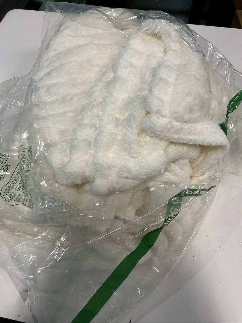 Condition photo showing Good Condition for Bedsure GentleSoft White Throw Blanket for Couch - Cozy Fleece Throw Blanket for Women Girls, Valentines Day Gifts for Her Him, Birthday Gifts for Women, Room Home Boho Decor, Off White, 50x60 Inches Off White Throw (50" x 60")