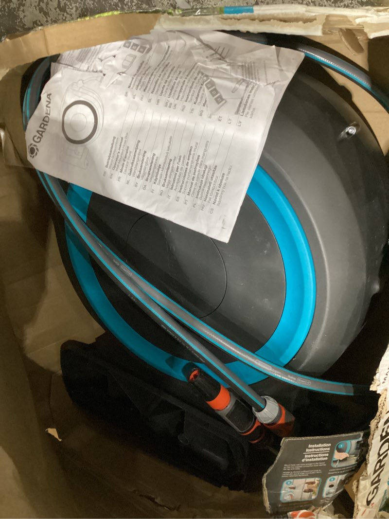 Condition photo showing Good Condition for gardena (18630) retractable garden hose reel 115' x 1/2" wall mounted, automatic retraction & length lock for easy watering. heavy duty swivel bracket 180°, includes nozzle. made in europe 115 ft