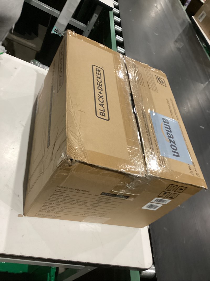 Condition photo showing As Is for BLACK+DECKER EM720CB7 Digital Microwave Oven with Turntable Push-Button Door, Child Safety Lock, 700W, Stainless Steel, 0.7 Cu.ft 0.7 cu. ft.