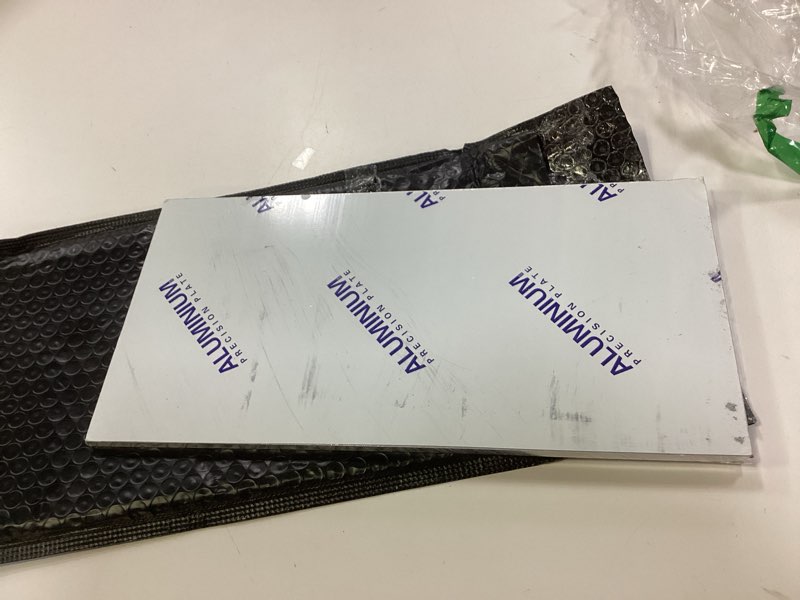 Condition photo showing As Is for 1/4Inch Thick Aluminum Sheet Plate, 6” x 12” Heavy Duty Aluminum Sheets Plates with Protective Film, 6061 Flat Plain Panel Plate Solid Metal Sheet Plate for Crafting Structural Framing Base Plate 6x12" 1/4"