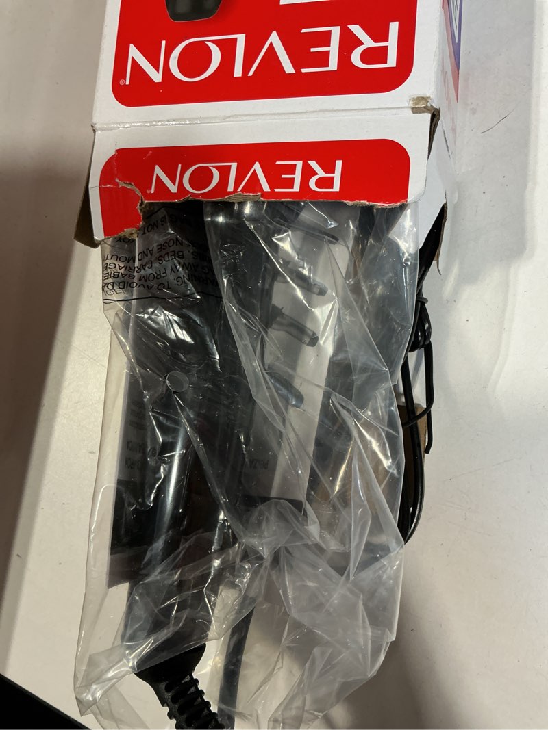 Condition photo showing New/Like New for revlon curling iron
