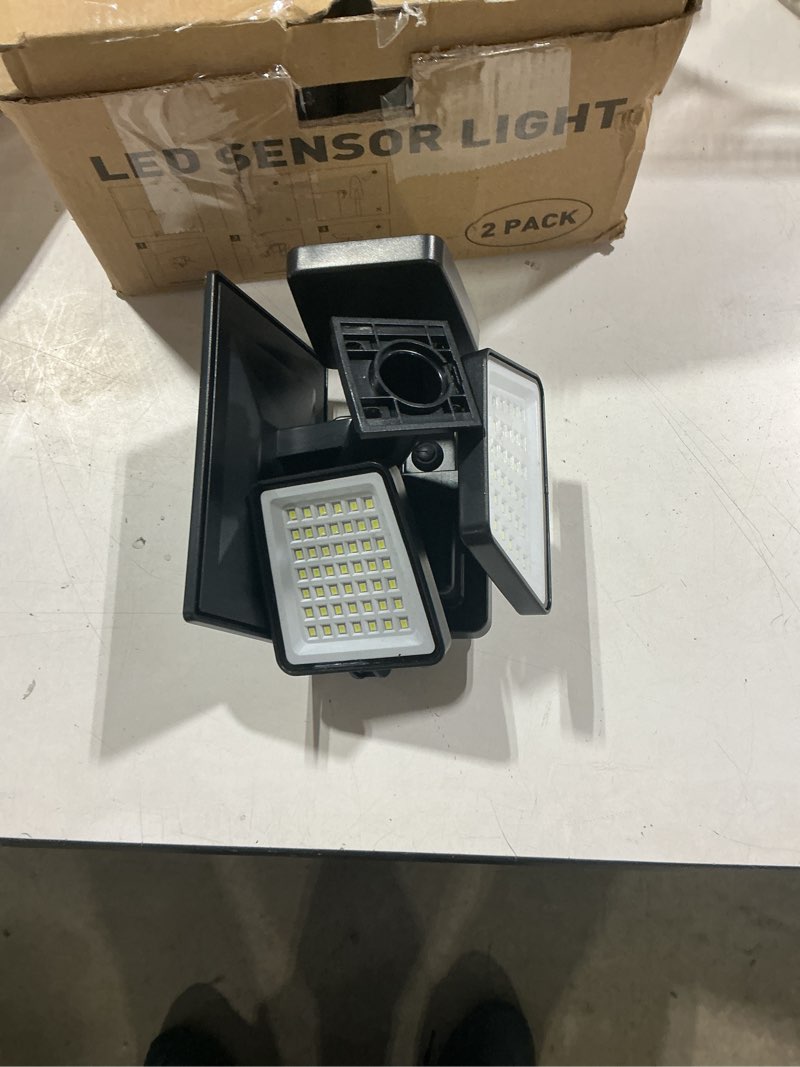 Condition photo showing Good Condition for home zone living 2pk solar flood lights black motion sensor wide angle | 120 degrees, waterproof powered for garden yard pathway, 3500k warm white 1000 lumens, adjustable triple head no wiring