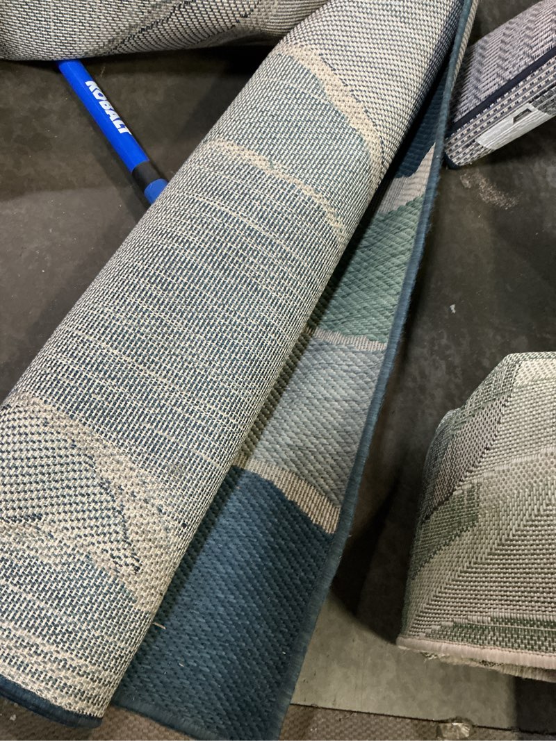 Condition photo showing As Is for  origin 21 with stainmaster aqua wave 8 x 10 (ft) loomed polypropylene blue