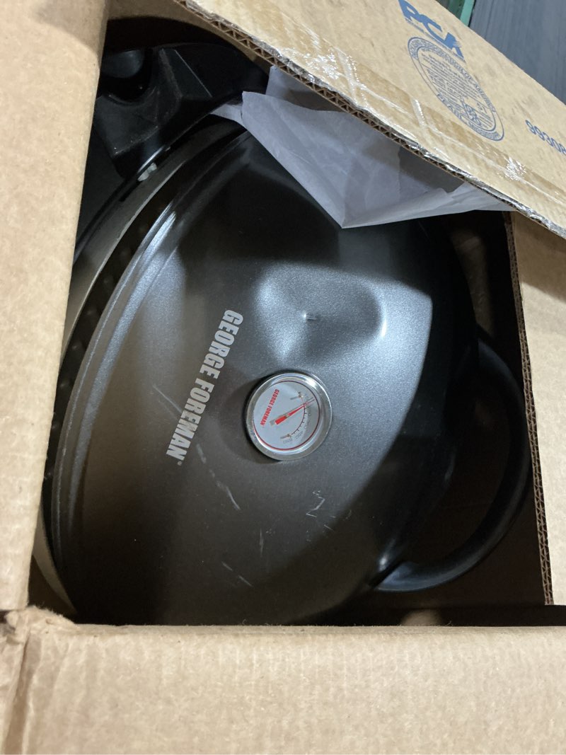 Condition photo showing As Is for george foreman indoor/outdoor electric patio grill, apartment approved, 15-serving, removable stand, black electric grill black