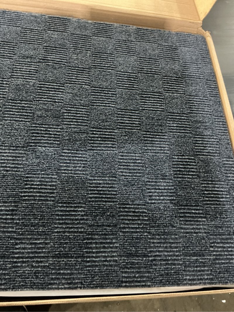 Condition photo showing Good Condition for mohawk home 24" x 24" indoor/outdoor 0.25" pile height, peel and stick carpet tile, blue polyester, (15 tiles) (60 sqft/box) navy blue