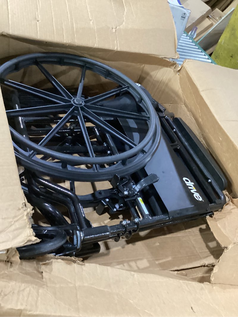 Condition photo showing New/Like New for drive medical silver sport 1 folding transport wheelchair - lightweight mobility support - full armrests - removable swing-away footrests - durable steel construction - compact folding frame - black