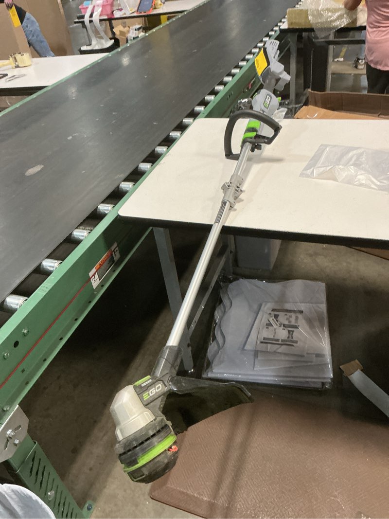 Condition photo showing As Is for ego power+ multi combo kit: 15-inch string trimmer & power head with 5.0ah battery & charger (mst1501), plus 8-inch carbon fiber edger attachment (ea0820) trimmer + edger + power head