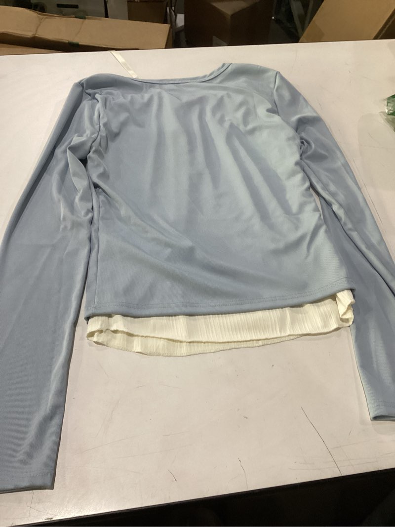 Condition photo showing Good Condition for childrens light blue long sleeve top with cream under shirt size unknown