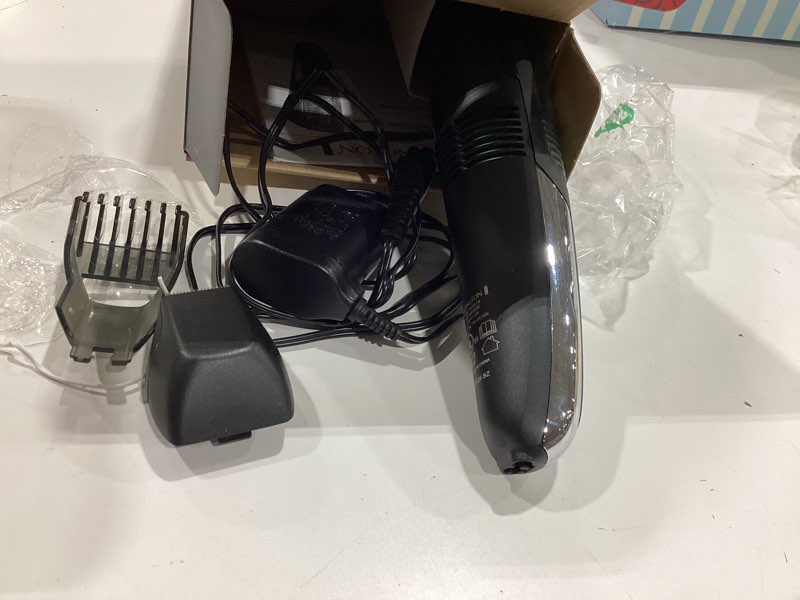 Condition photo showing As Is for remington vacuum beard trimmer,13 length and style settings with adjustable length comb (2-18mm),vacuum trimmer for beard, mustache, and stubble, rechargeable lithium power, washable, removable blades 2 piece set black/green