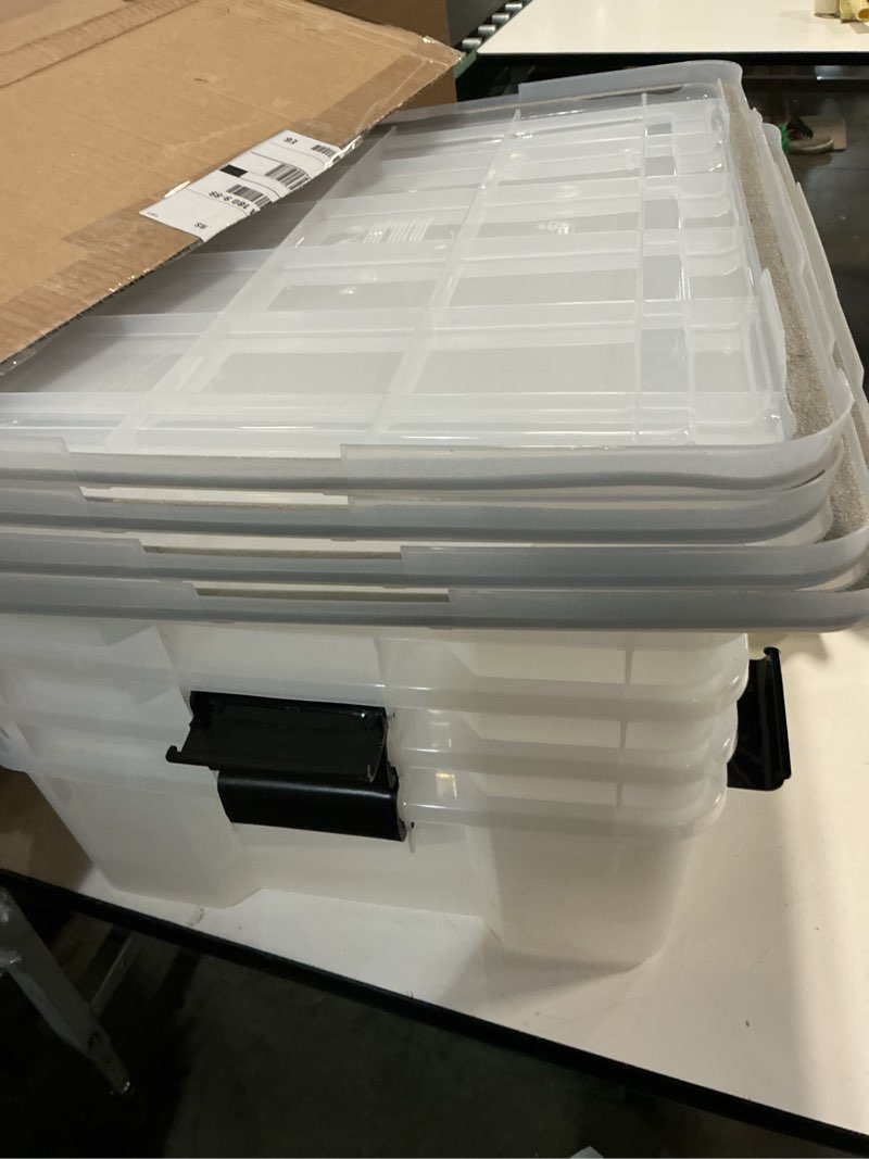 Condition photo showing As Is for iris usa weatherpro 41 qt storage bins with lids, 4 pack, bpa-free plastic gasket box with tight latch and seal, stackable nestable tote tub - clear/black 41 qt. - 4 pack