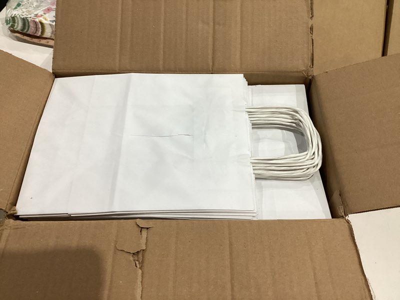 Condition photo showing New/Like New for Qutuus White Paper Bags with Handles Bulk 100Pcs 8x4.5x10 White Gift Bags, Recyclable Kraft Paper Bags, Medium Paper Gift Bags for Shopping, Party Favor, Retail, Wedding White 8x4.5x10 Inch (Pack of 100)