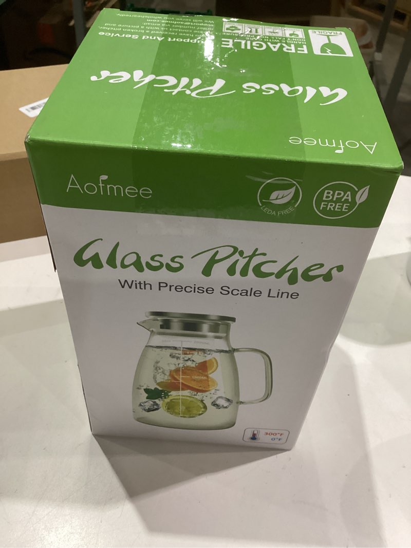 Condition photo showing Good Condition for Aofmee Glass Pitcher with Lid, 68oz Water Pitcher with Handle and Precise Scale Line, Stainless Steel Iced Tea Carafe, Heat Resistant Borosilicate Jug for Juice, Milk, Cold or Hot Beverages 68 OZ