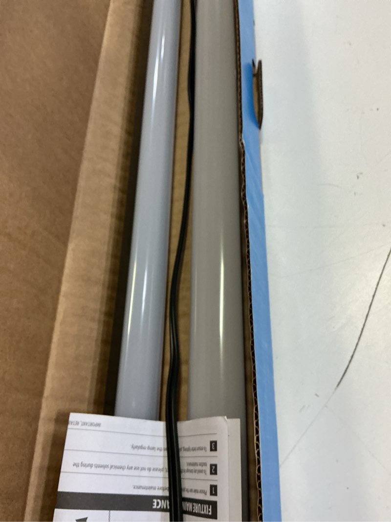Condition photo showing As Is for utilitech 4-ft 7000-lumen black led flush mount garage shop light