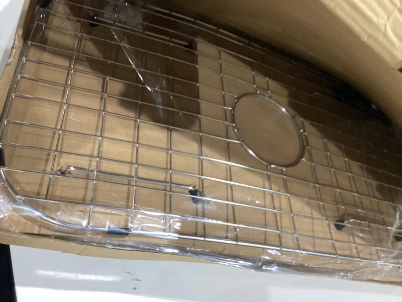 Condition photo showing Good Condition for sink protector grid 26-1/16" x 14-1/16", centered drain with corner radius 3-1/2", 304 stainless steel material (centered drain) 26-1/16" x 14-1/16" centered drain