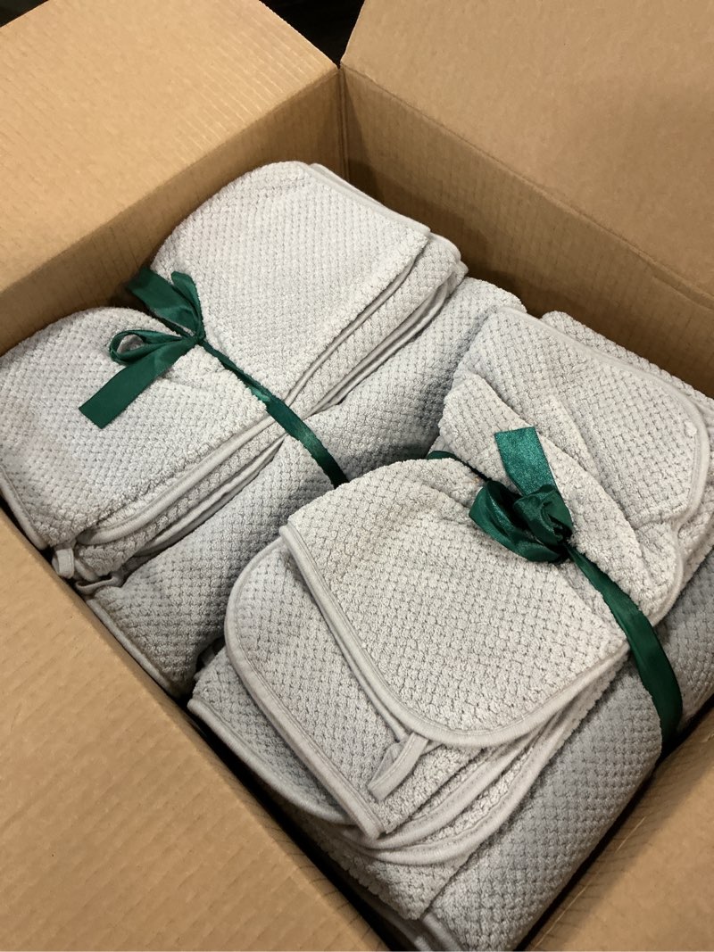 Condition photo showing As Is for REDKISS 6 Piece Premium Towel Set, 2 Bath, 2 Hand, and 4 Wash Cloths, Ultra-Fiber Coral Fleece, Highly Absorbent Towels for Bathroom, Gym, Hotel, and Spa, Ideal for Everyday use, Light Grey Grey Bath Towel Set of 6