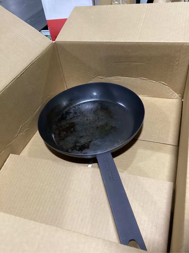 Condition photo showing Good Condition for merten & storck pre-seasoned carbon steel 10” frying pan skillet, use on induction, stove and grill, durable, even-heating, for searing, grilling, oven use, and campfire, indoor/outdoor 10" frying pan skillet black