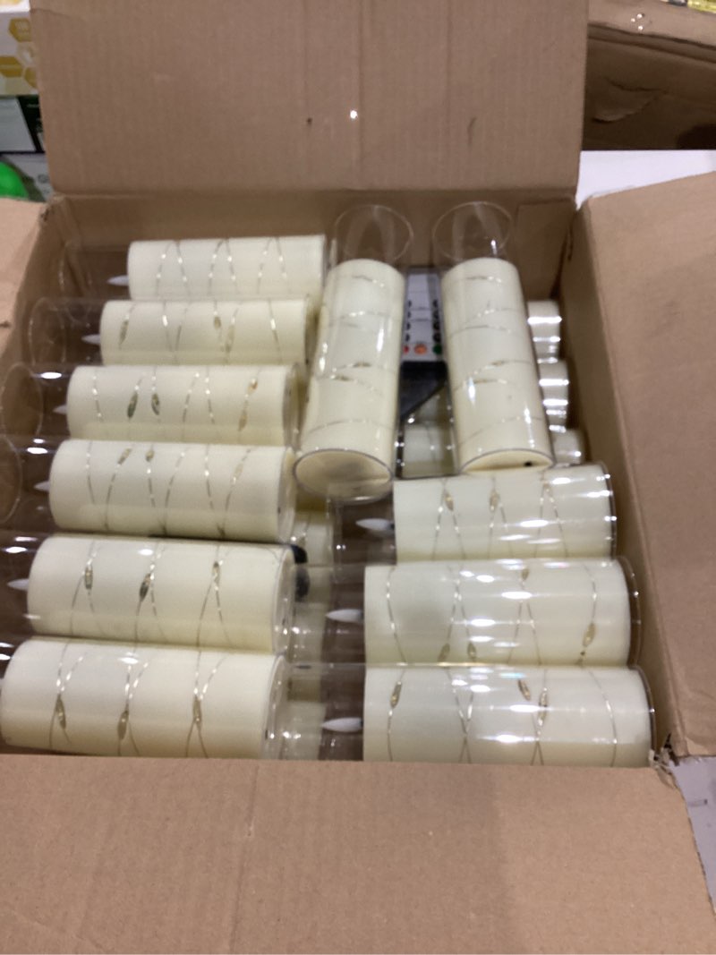 Condition photo showing Good Condition for 24 Pcs LED Flameless Candles with Remote, 3D Flickering Flame & LED String Lights, Acrylic Clear Cylinder, Timer Function, Romantic Ambience for Home Decor, Party, Wedding. Strip Light String-24Pack