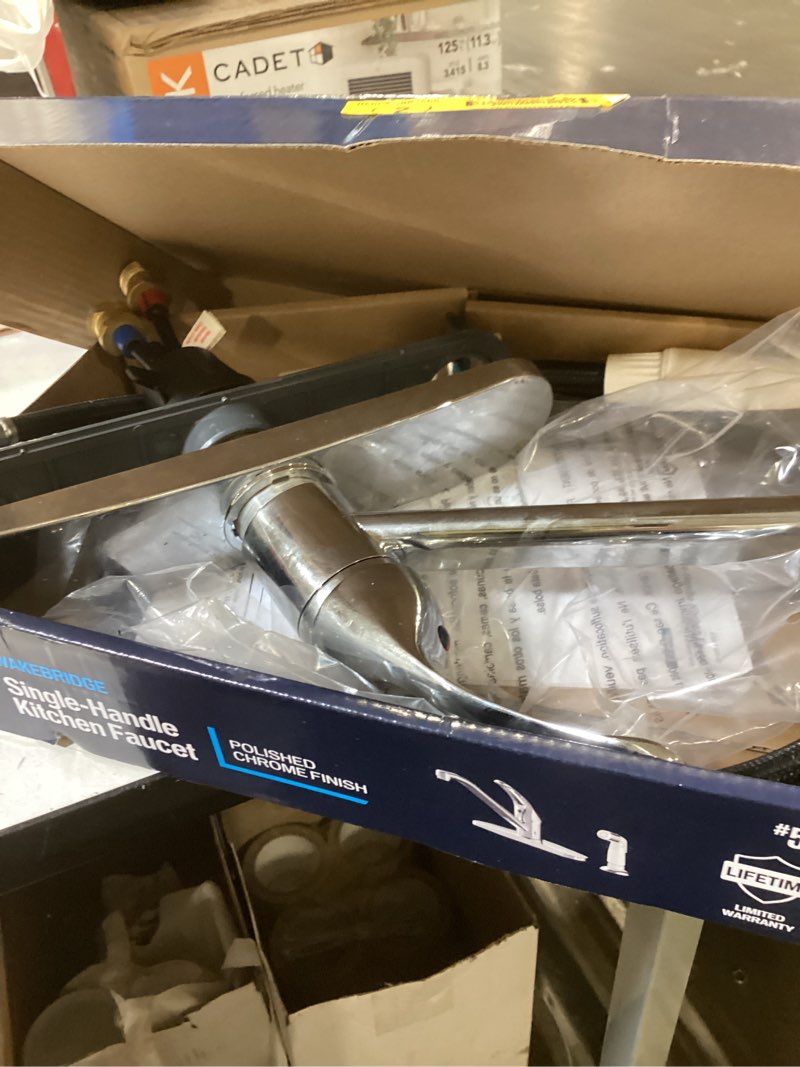 Condition photo showing As Is for project source wakebridge polished chrome single handle deck-mount kitchen faucet
