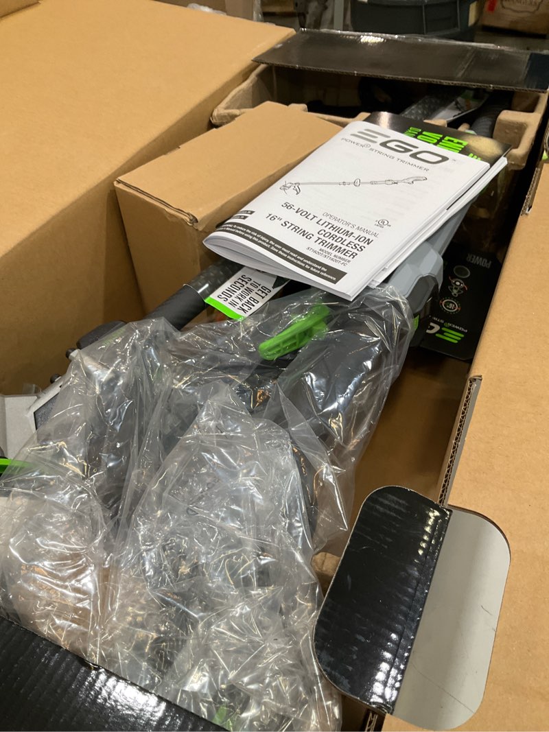 Condition photo showing As Is for ego power+ line iq with powerload st1623t 16 in. 56 v battery string trimmer kit (battery & charger) w/ telescopic shaft & 4.0 ah battery