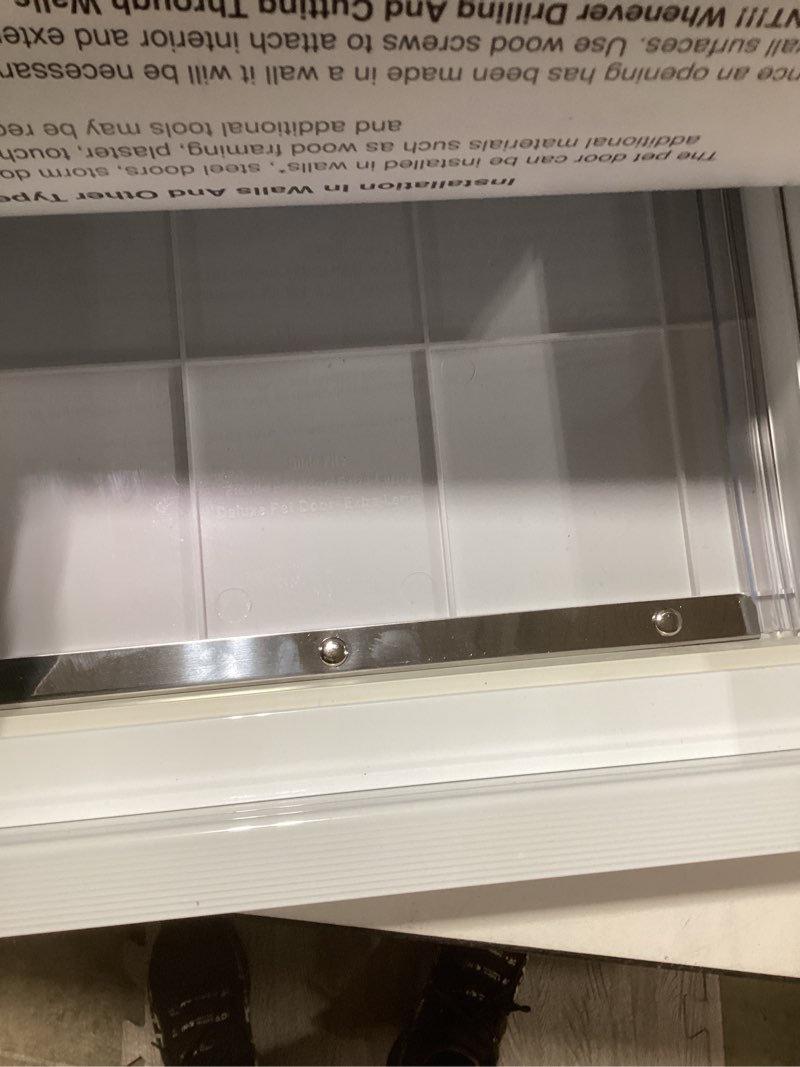 Condition photo showing New/Like New for IDEAL PET PRODUCTS Since 1979 Ideal Pet Products Deluxe Aluminum Pet Door with Telescoping Frame, Extra Large, 10.5" x 15" Flap Size, White Extra Large - 10.5" x 15" Flap Size