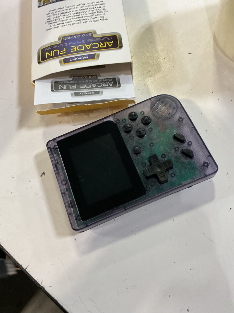 Condition photo showing As Is for merkury innovations portable handheld video game console with 200 classic games