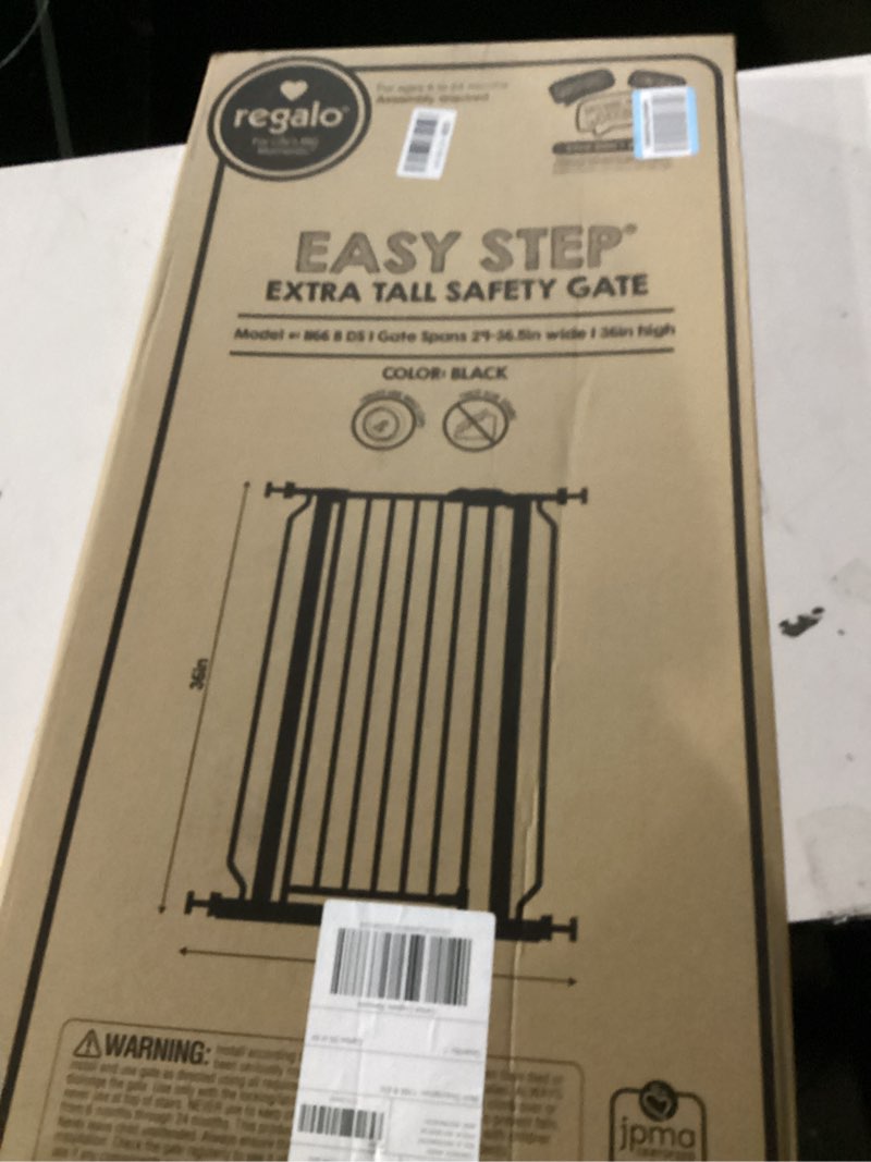 Condition photo showing New/Like New for Regalo Safety 36" Extra Tall Baby Gate for Doorways & Bottom of Stairs, Pressure Mounted Walk Through Gate for Babies, Toddlers & Pets, Tested & Safe for 30 Years, American Designed, American Owned Black 29-36.5"W x 36"H