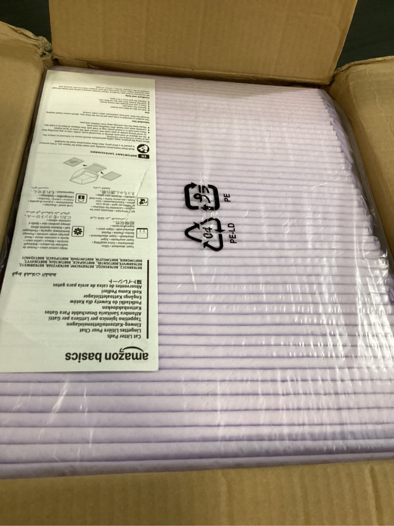 Condition photo showing New/Like New for amazon basics cat pee pads, super absorbent, odor control with fresh scent, universal fit for litter box, multi cat, disposable, white/purple, 100 count