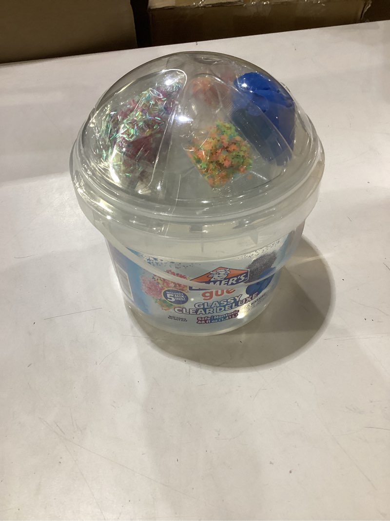 Condition photo showing New/Like New for elmer's gue premade includes 5 sets of slime add-ins, 3 lb. bucket, glassy clear