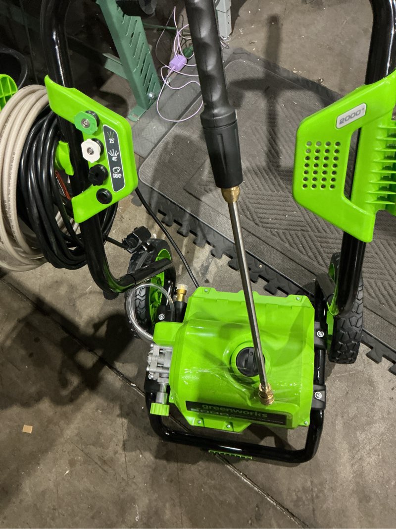 Condition photo showing As Is for greenworks 2000-psi 1.1-gpm cold water electric pressure washer with 3 spray tips