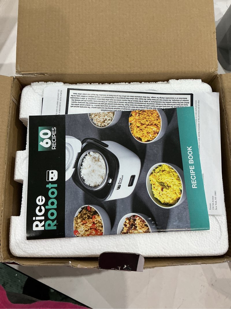 Condition photo showing Good Condition for rice robot personal rice cooker, pfas-free, nonstick. 1 quart capacity, with stainless steel steamer tray, measuring cups, recipe book with 60 recipes, and serving spoon, as seen on tv 2-cup (uncooked) | 4-cup cooked