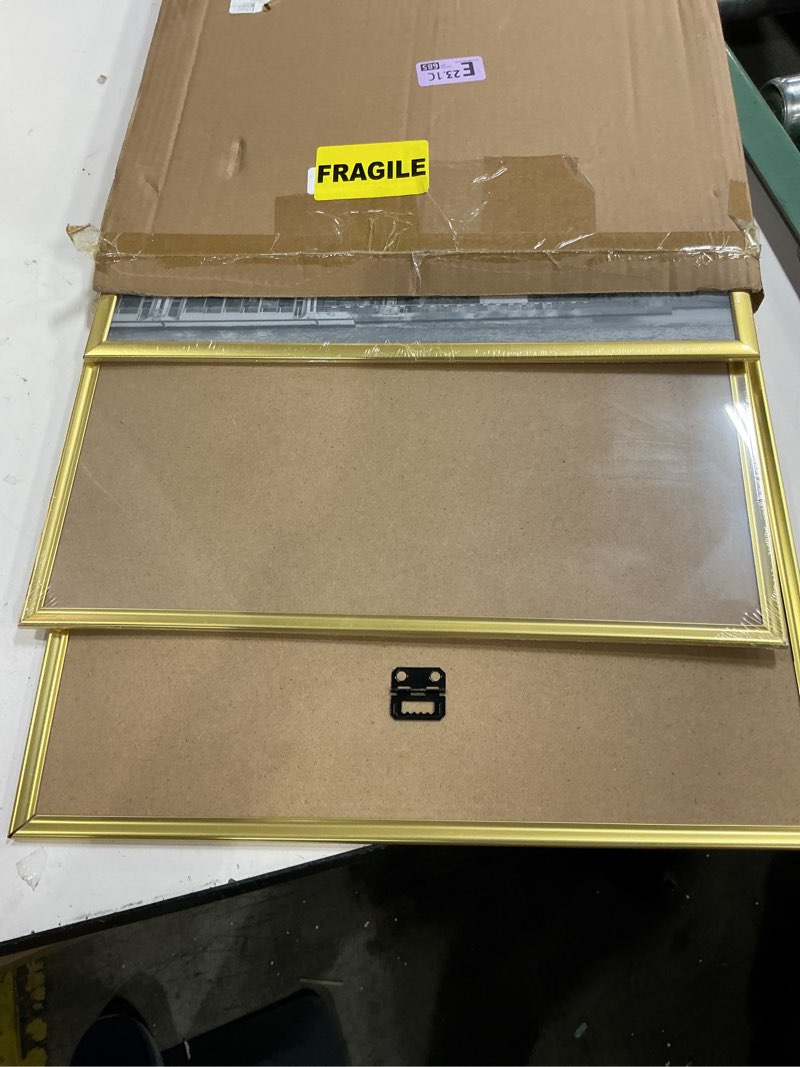 Condition photo showing Good Condition for upsimples 16x24 picture frame gold 3 pack, scratch-proof poster frames 16 x 24 for photo gallery - slide-in strips, horizontal or vertical wall mounting gold 16x24