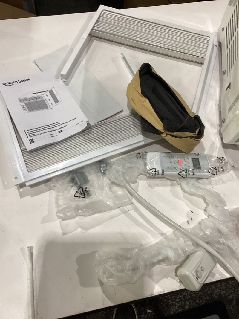 Condition photo showing New/Like New for amazon basics 6000-btu window air conditioner with quiet operation, up to 250 sqf, cool and fan functions, washable filter, adjustable window kit, digital temperature display, remote control, white