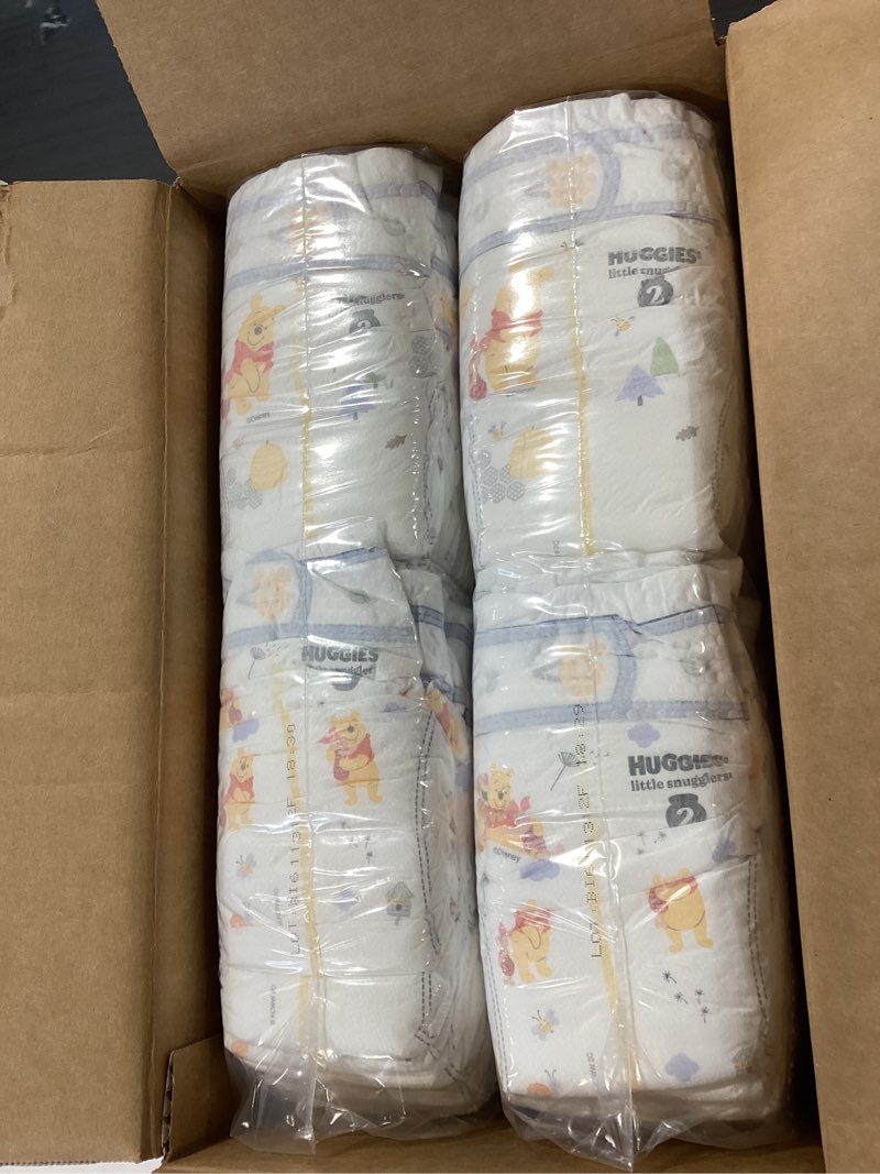 Condition photo showing As Is for huggies size 2 diapers, little snugglers baby diapers, size 2 (12-18 lbs), 148 count, packaging may vary size 2 148