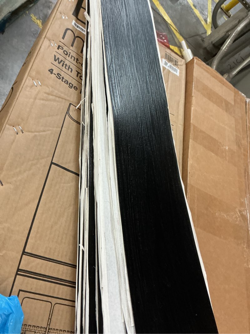 Condition photo showing As Is for Art3d 36-Pack 54 Sq.ft Peel and Stick Floor Tiles Vinyl Plank Flooring Wood Look, Adhesive and Waterproof Tile Sticker for Bedroom, Living Room, Kitchen, RV in Black 36 x 6 x 0.1 inches Black 36