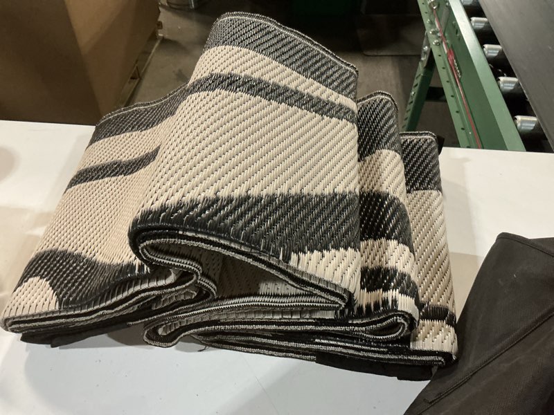 Condition photo showing Good Condition for wonnitar 6x9 outdoor rug, waterproof plastic straw rv outdoor rugs, reversible large portable rv camping rugs, outsided abstract flower patios area rug for deck backyard balcony (black & white, 6'x9') 6' x 9' (rectangular) black
