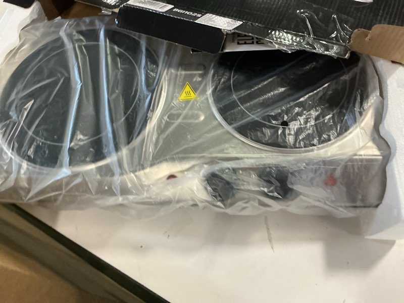 Condition photo showing item condition for OVENTE BGI102S Countertop Infrared Double Burner, 1700W Electric Hot Plate and Portable Stove with 7.75" and 6.75" Ceramic Glass Cooktop, 5 Level Temperature Setting and Easy to Clean Base, Silver