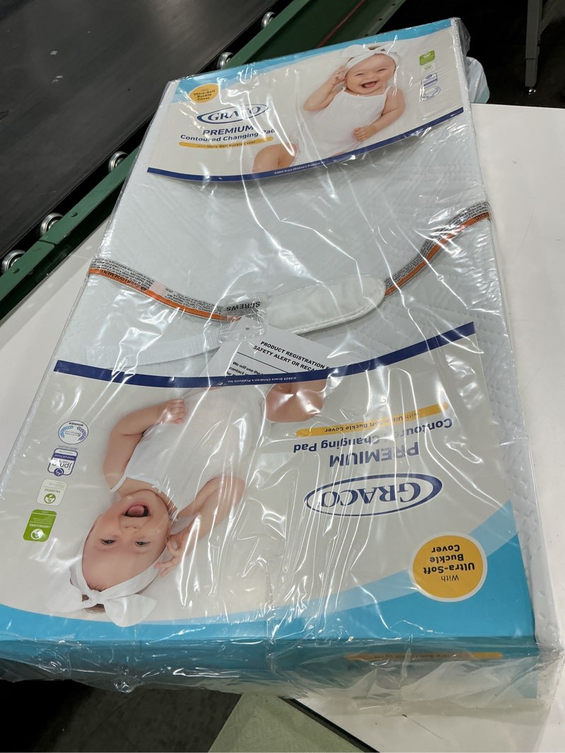 Condition photo showing New/Like New for Graco Premium Contoured Changing Pad – GREENGUARD Gold Certified, Water-Resistant, Ultra-Soft Buckle Cover, Contoured Baby Changing Pad, Fits Most Standard-Size Changing Toppers, Non-Skid Bottom